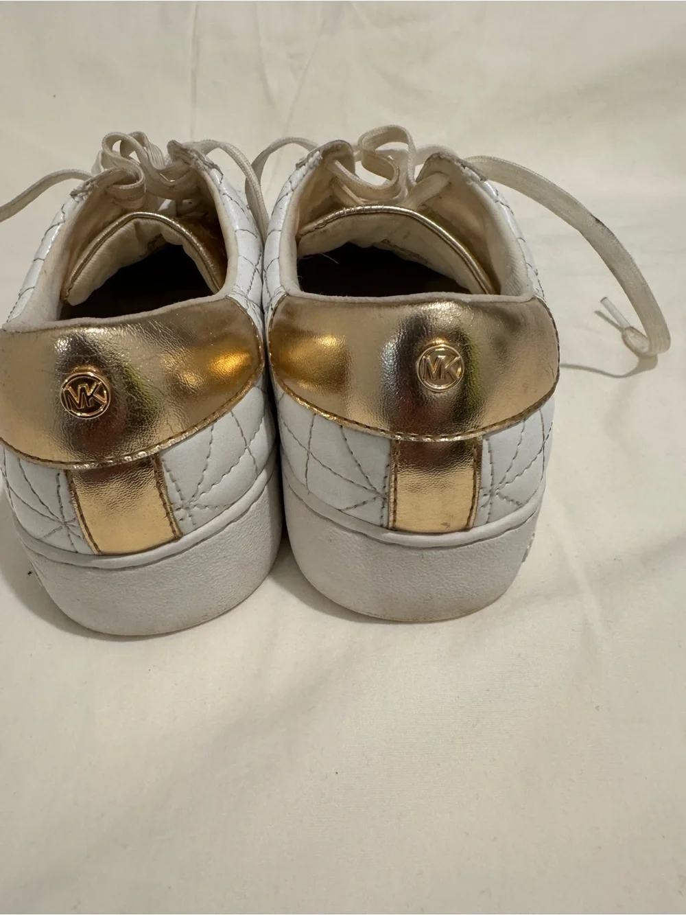 MICHAEL Michael Kors White Quilted Sneakers with Gold Accents